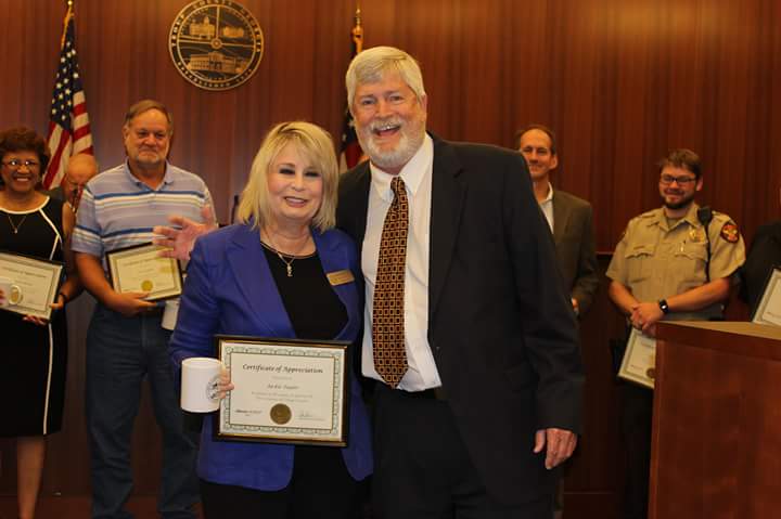Jackie Taylor pictured with County Mgr, Tod Tentler receiving 25 Yr Service Award